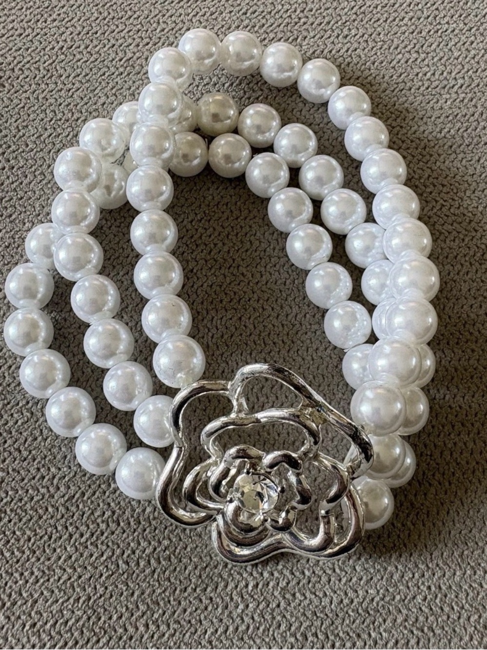 Elegant White Pearl Stretch Bracelet with Silver Floral Clasp
